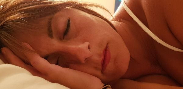 Close-up of young woman sleeping