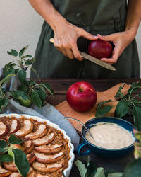 Midsection of woman preparing food on table