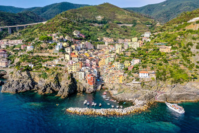 High angle view of townscape by sea