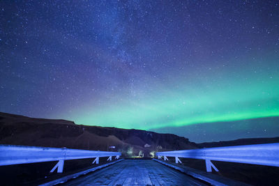 Scenic view of landscape against clear sky at night