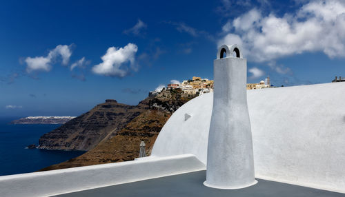 Building against sky with sea in background