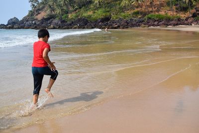 Full length of boy on beach