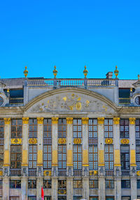 Low angle view of building against blue sky