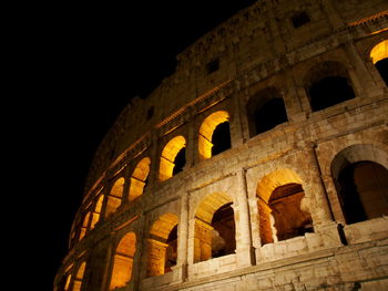 Low angle view of historical building at night