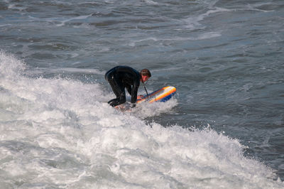 Man surfing in sea