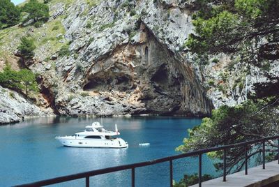 Sailboat on rock by sea