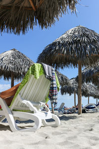 Palm trees on beach against clear sky