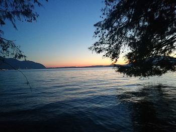 Scenic view of sea against sky at sunset