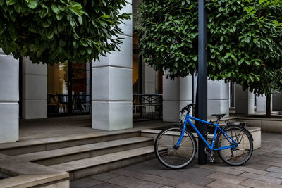 Bicycle against building in city