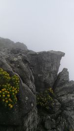 Scenic view of rocky mountains against clear sky