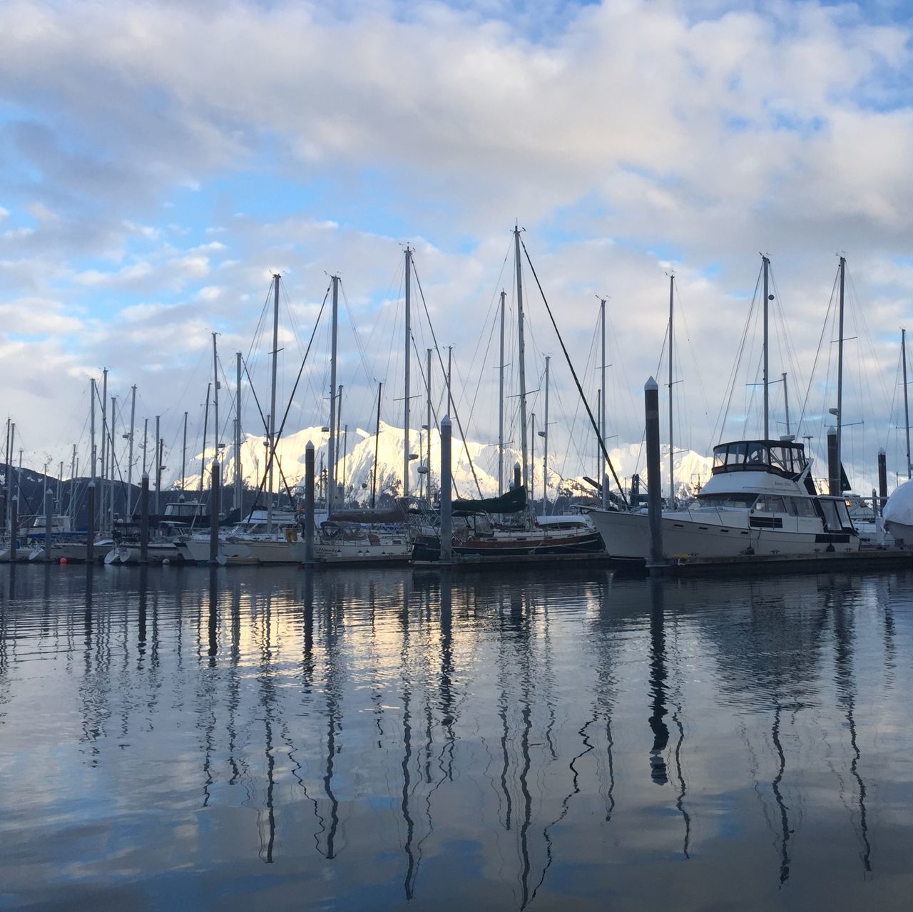 nautical vessel, moored, transportation, boat, water, mode of transport, mast, sky, sailboat, reflection, harbor, waterfront, cloud - sky, sea, marina, lake, tranquility, cloud, tranquil scene, nature