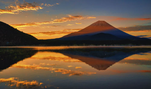 A world heritage site  mt.fuji dyed in the morning glow clouds