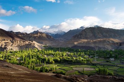 Scenic view of mountains against cloudy sky