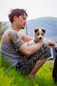 Man with dog on field