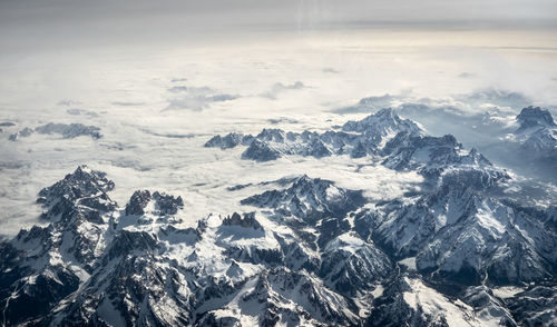 Scenic view of snowcapped mountains against sky