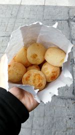 High angle view of hand holding bread