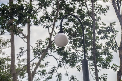 Low angle view of street light against sky