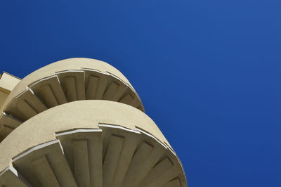 Low angle view of building against clear blue sky