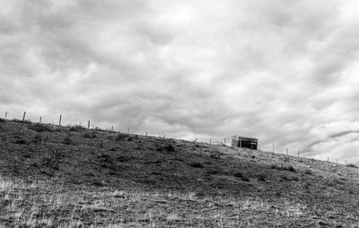 Low angle view of castle on hill against sky