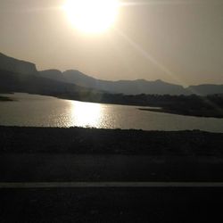 Scenic view of lake against sky during sunset