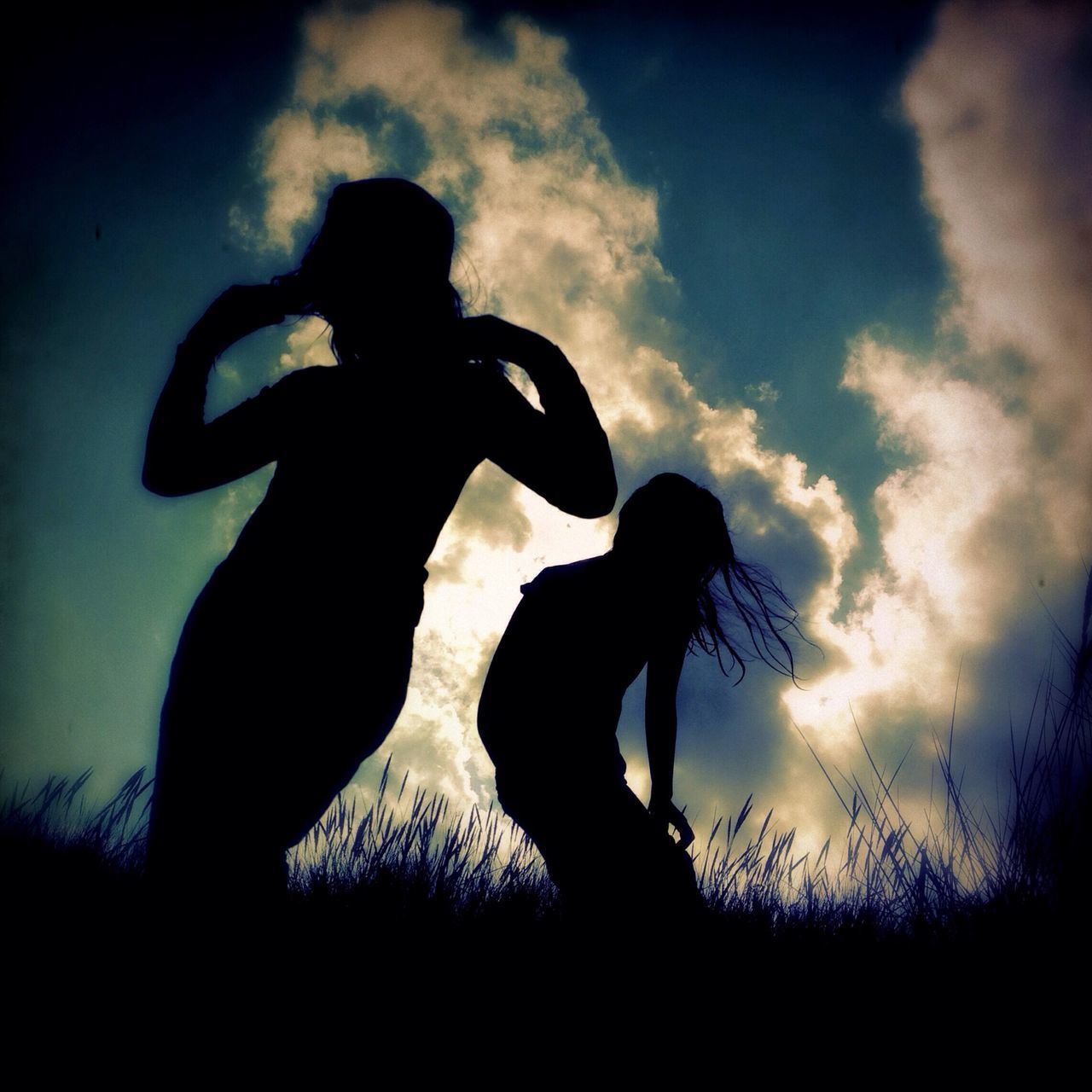 silhouette, sky, cloud - sky, low angle view, sunset, one person, standing, cloud, three quarter length, outline, field, dusk, nature, outdoors, cloudy, auto post production filter, leisure activity, back lit, beauty in nature, side view