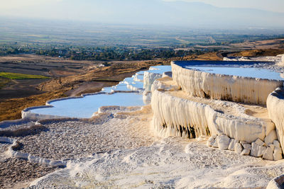 Scenic view of landscape against sky during winter