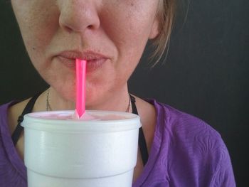 Close-up of man drinking glass