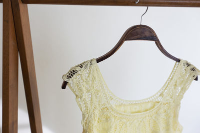 Close-up of clothes hanging on wall at home