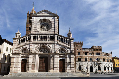 Low angle view of cathedral against sky in grosseto -italy