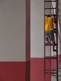 Full length of child on wall