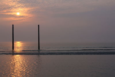 Scenic view of sea at sunset