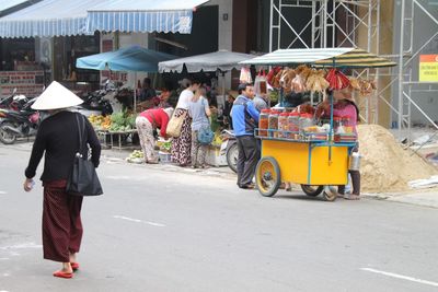 Full length of people at market stall