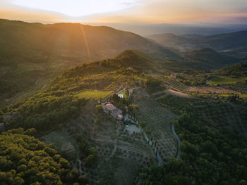 Aerial view of tuscany italy. magic evening, sunset, appenines mountains farmland. vineyards olives