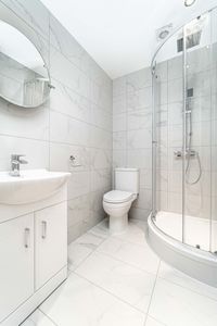 Minimalist bathroom with tiled flooring 