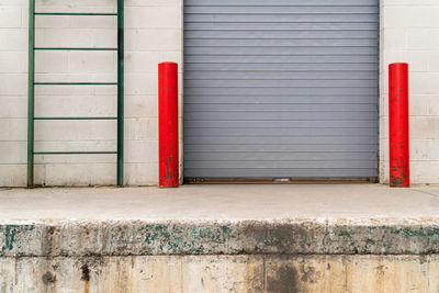 Red closed door of building