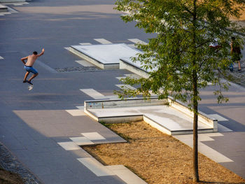 High angle view of man skateboarding on street