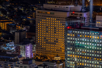 High angle view of smile illuminated buildings at night