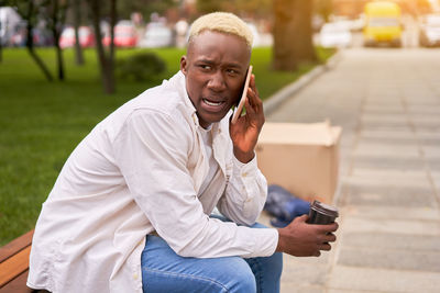 Portrait of man using mobile phone