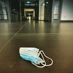 Close-up of shoes on floor in building