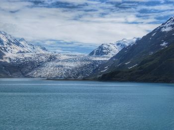 Scenic view of lake and mountains against sky