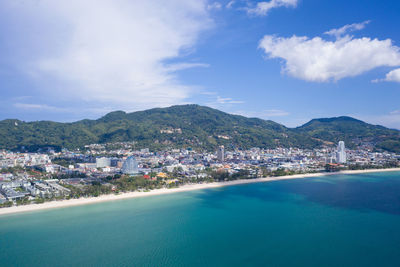 Scenic view of sea and buildings against sky