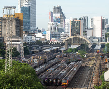 High angle view of train amidst buildings in city