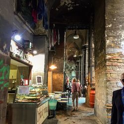 People in illuminated city at night