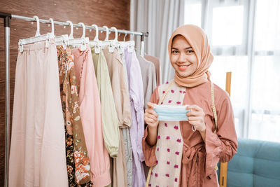 Portrait of smiling young woman at home