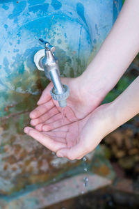 Close-up of hand holding water