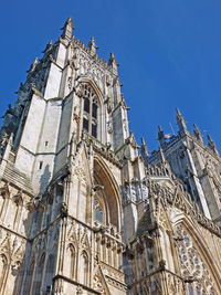 Low angle view of temple building against blue sky