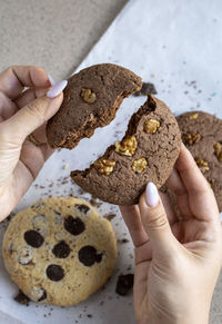 Cropped hand of person holding food