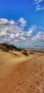 Scenic view of beach against sky