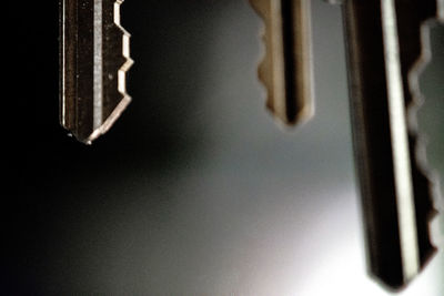 Close-up of icicles hanging on wall of house