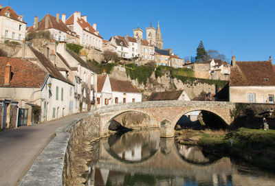 Semur-en-auxois, remarkable heritage site, its medieval streets and pinard bridge in burgundy 